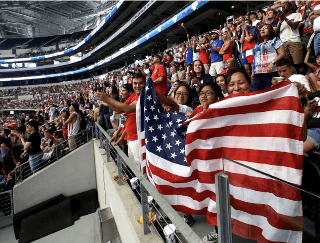 Hundreds of cheering US football fans are seen at a 2014 FIFA World Cup watch party at the AT&T Stadium in Arlington, Texas, in file photo.  US host cities assure global fans welcome at FIFA World Cup 2026