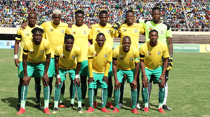 Players of Congo's men's national football team pose for a photo in the field for a game in file photo. FIFA allows Congo to play World Cup qualifiers after March ban
