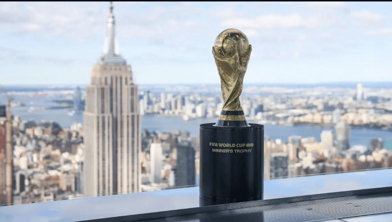 The FIFA World Cup 2026 winner's trophy is on display amid a city backdrop in the US in file photo. ]US host cities assure global fans welcome at FIFA World Cup 2026