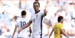 Striker harry Kane points his left finger to the crowd's direction while playing for England in file photo.