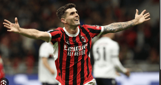 Christian Pulisic raises his arms in celebration while playing for AC Milan in in file photo. FIFA World Cup 2026 Profile: Christian Pulisic