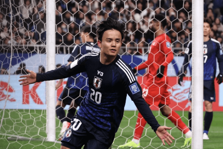 Japan's Takefusa Kubo spreads his arms wide after celebrating a goal by his team in file photo.