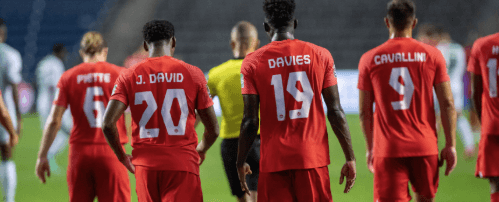 Members of Canada's men's national football team (in red shirts) head back to the field for a match in file photo. Canada Soccer eyes more Reds' home games before World Cup