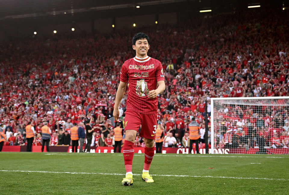 Midfielder Wataru Endo smiles to the crowd as he walks down the pitch while playing for Liverpool in file photo. FIFA World Cup 2026 Profile: Wataru Endo