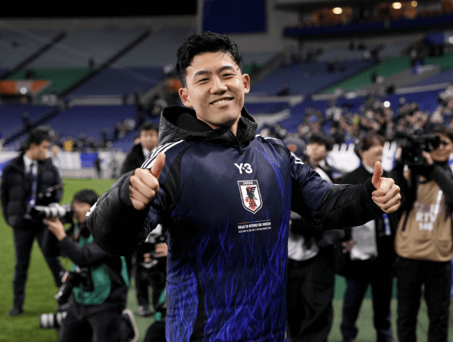 Midfielder Wataru Endo smiles to the crowd while playing for Japan's men's national team in file photo. FIFA World Cup 2026 Profile: Wataru Endo