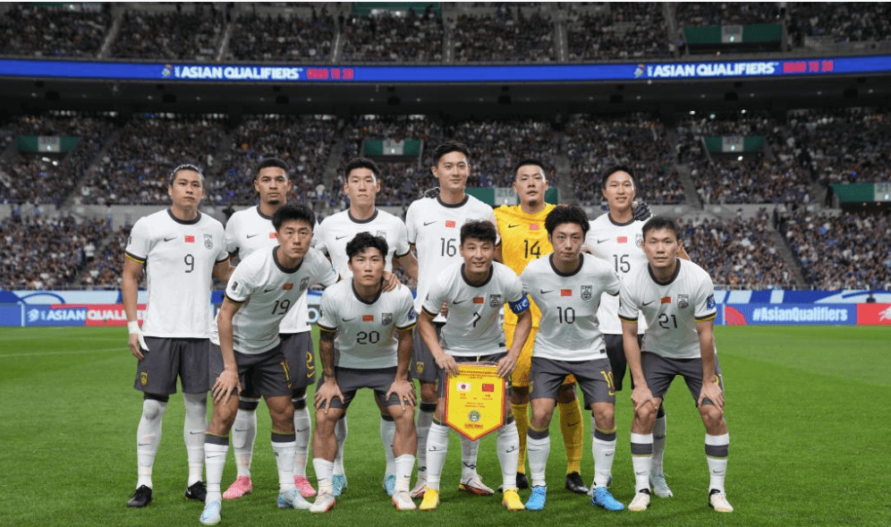 Members of China's men's football team pose in the field despite losing to Indonesia 0-1, in a World Cup qualifying match. China shifts focus to esports team after World Cup qualifying exit