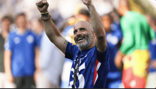 Coach Enzo Maresca raises his arms in celebration while smiling towards fans after steering Chelsea to a 3-0 win over PSG and win the FIFA Club World Cup title on Sunday. Chelsea vs PSG final sees Palmer brace key Blues' CWC title win