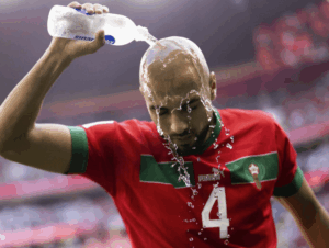 A player quenches himself with cold water amid searing heat conditions in football matches in the US this year. FIFA World Cup 2026 could be 'most climate changing': report
