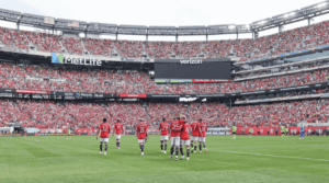 An image of football players at a huddle at MetLife Stadium in New Jersey is shown in file photo. FIFA World Cup 2026 start time change pushed, cites conditions