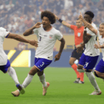Players from the US Ment's National Team (USMNT ), in white, run at the field during a match in file photo. USMNT's World Cup 2026 buildup resumes vs Ecuador, Australia