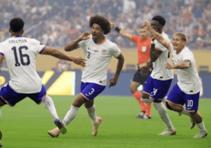 Players from the US Ment's National Team (USMNT ), in white, run at the field during a match in file photo. USMNT's World Cup 2026 buildup resumes vs Ecuador, Australia