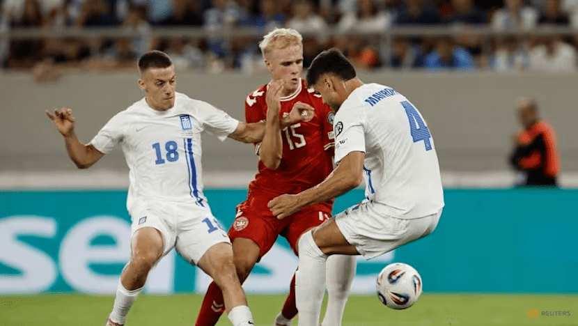 Denmark's Viktor Froholdt (15, middle) is surrounded by two Greek defenders as they battle ball posession in the Greece vs Denmark fixture on September 9 , 2025. Photo by Reuters