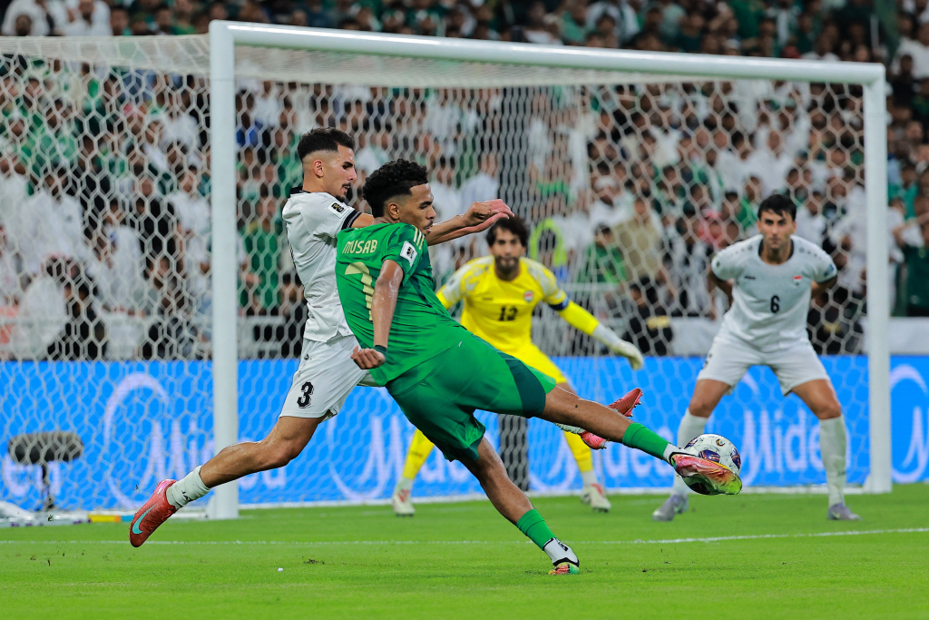 Saudi Arabia (in Green shirt) advanced to the World Cup despite settling for a draw at Jeddah.