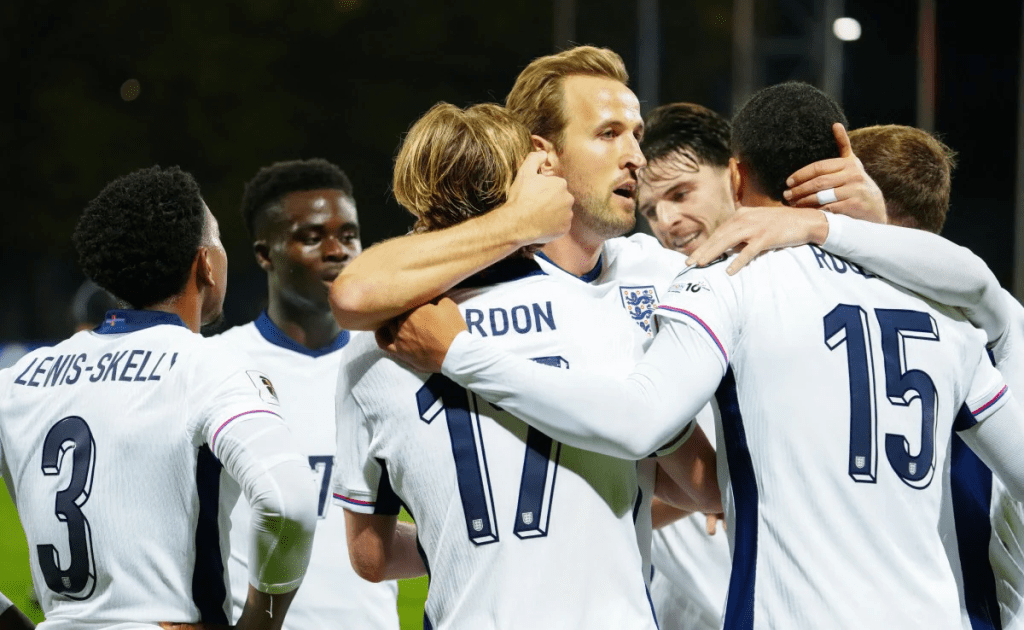 England players embrace after their team was the first from UEFA to reach the 2026 FIFA World Cup.