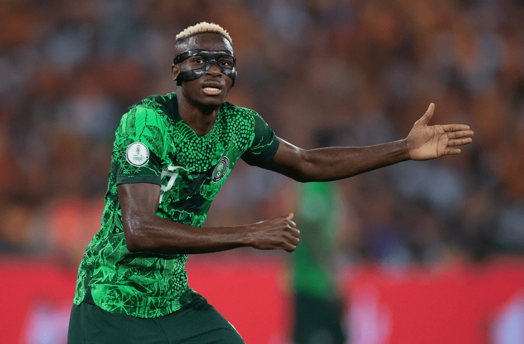 Victor Osimhen of Nigeria raises his left hand to get a teammate's attention in file photo.