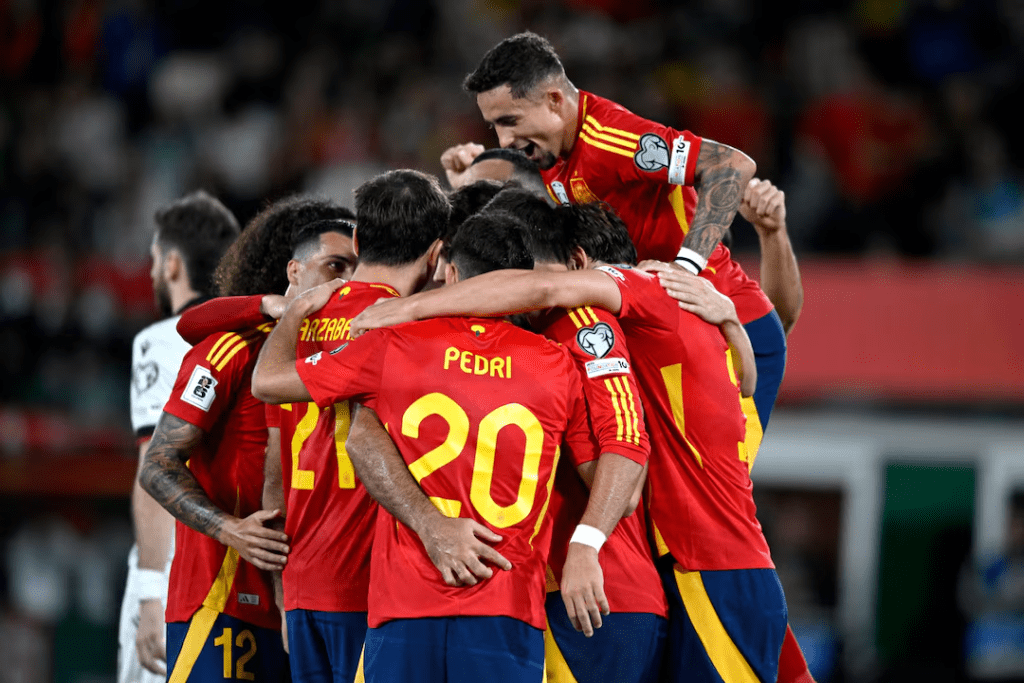 Pedri (20) and the rest of Spain's men's football team gather in a huddle in file photo.