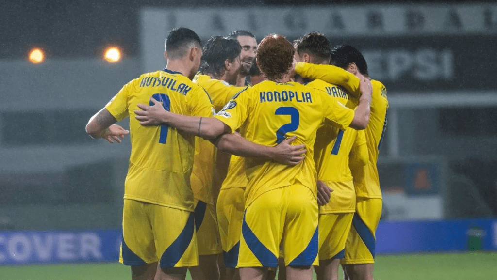 Ukraine players gather in a huddle to celebrate their 5-3 win over Iceland in a UEFA FIFA World Cup qualifying match on October 11, 2025