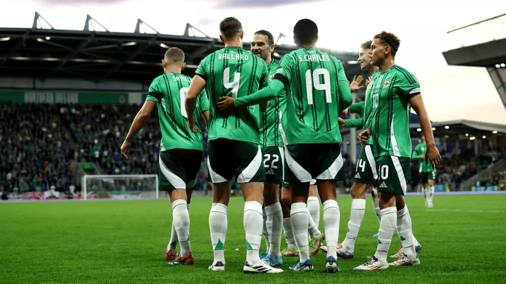 Players fro mNorthern Ireland gather in the field during a lull in the action in file photo.