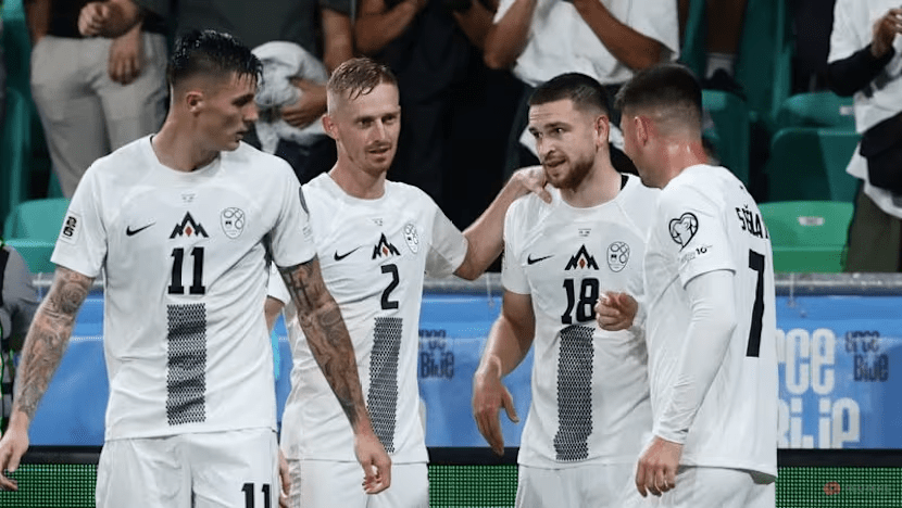 Sloevanian players gather in a huddle during a break in its World Cup Qualifying match against Sweden on September 2025