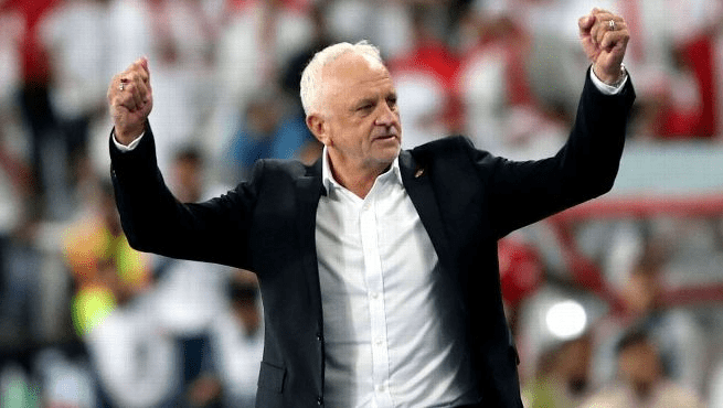 Coach Graham Arnold raises his hands in celebration after he steered Iraq to victory over the UAE in their AFC World Cup Qualifiers fixture on November 18, 2025