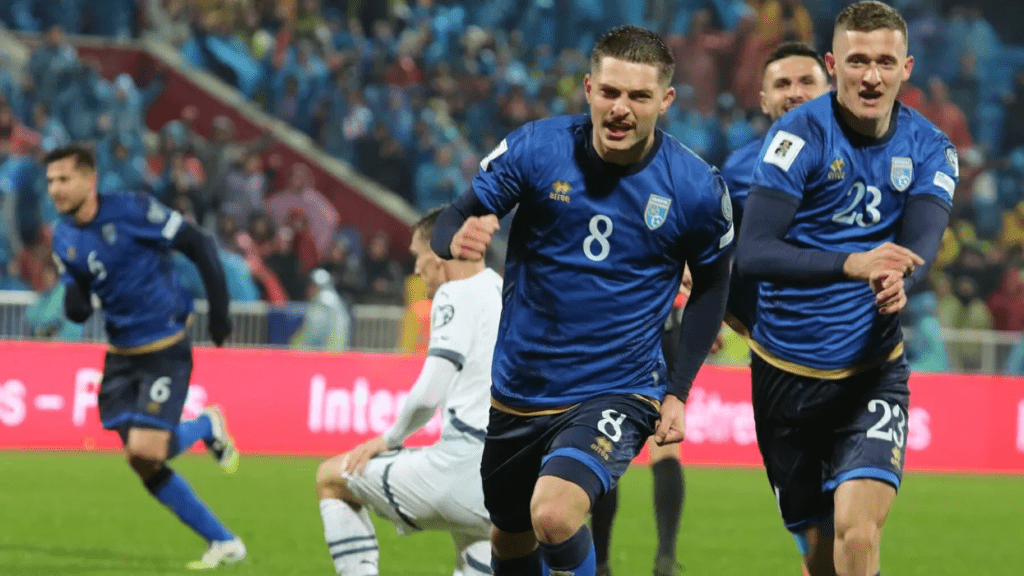 Florent Muslija (8, middle) was all smiles while running with his teammats after scoring a late goal for Kosovo in their UEFA World Cup Qualifiers match against Switzerland in Pristina.