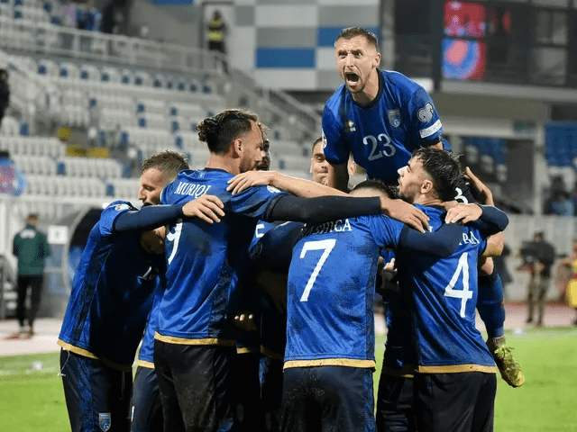 Members of Kosovo's men's football team celebrate after Florent Muslija's gosal ensured a draw against Switzerland in their UEFA World Cup Qualifiers match in November 19, 2025.